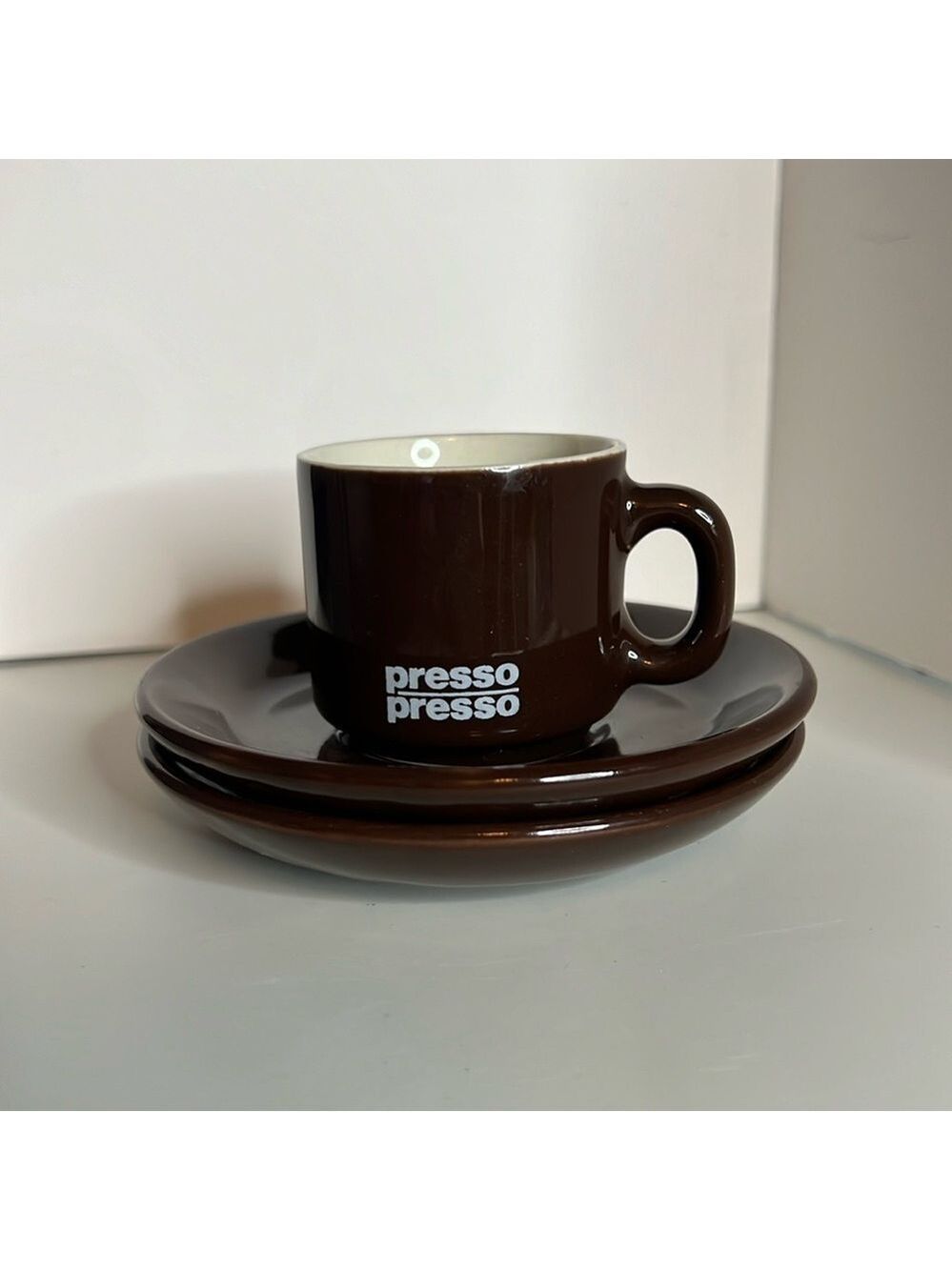 Exclusive Nestle Presso Demitasse Cup with 2 saucers. Brown and white.